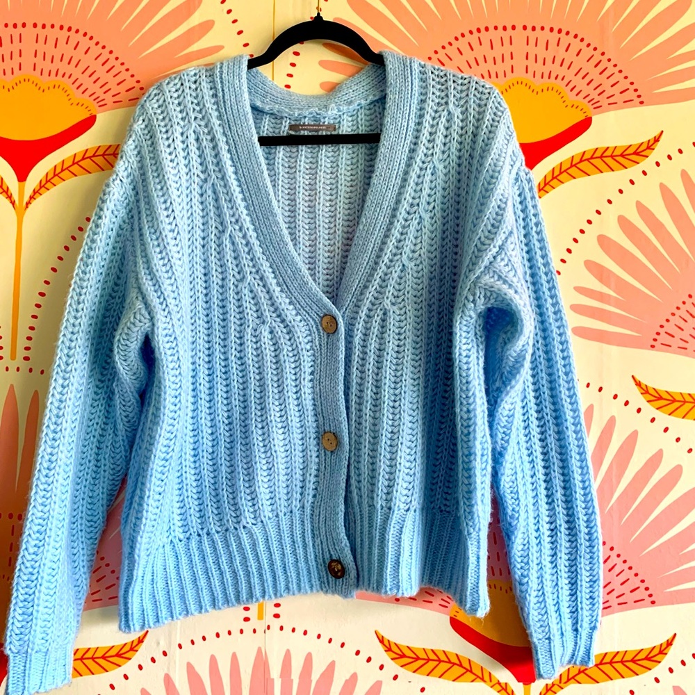 This is an Anthropologie baby blue cardigan knit sweater never been worn.